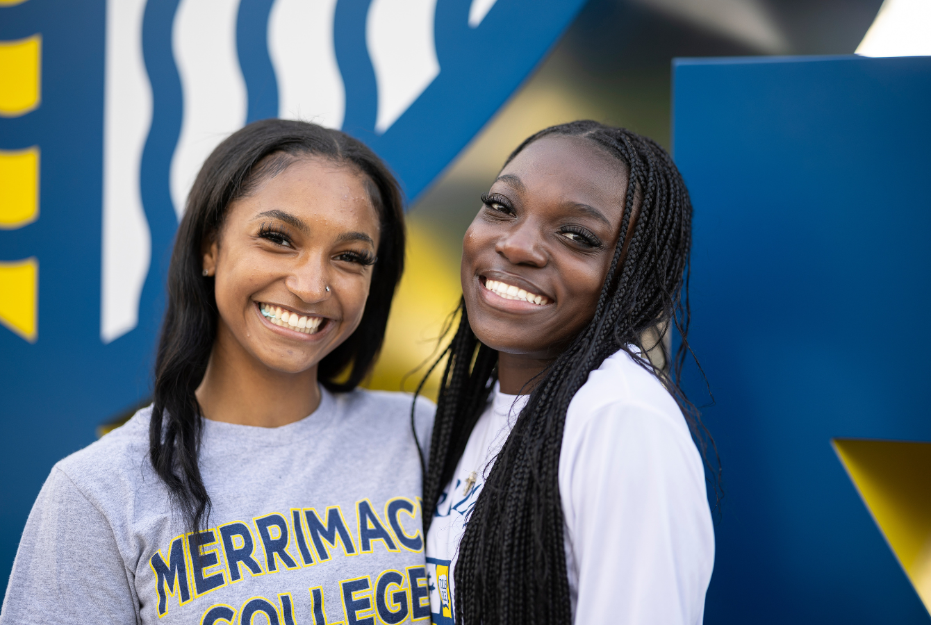 2 students smiling